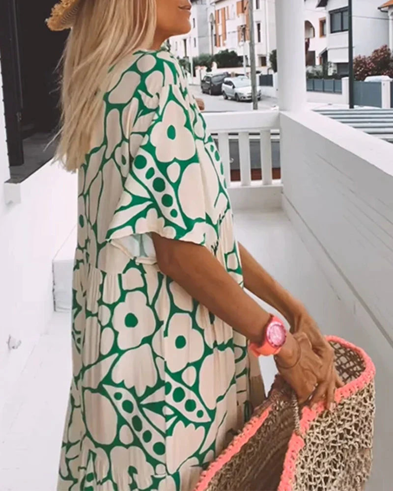 VESTIDO FLUIDO CON ESTAMPADO Y ESCOTE EN V