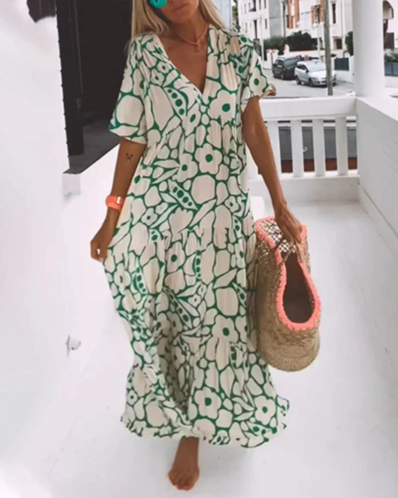 VESTIDO FLUIDO CON ESTAMPADO Y ESCOTE EN V