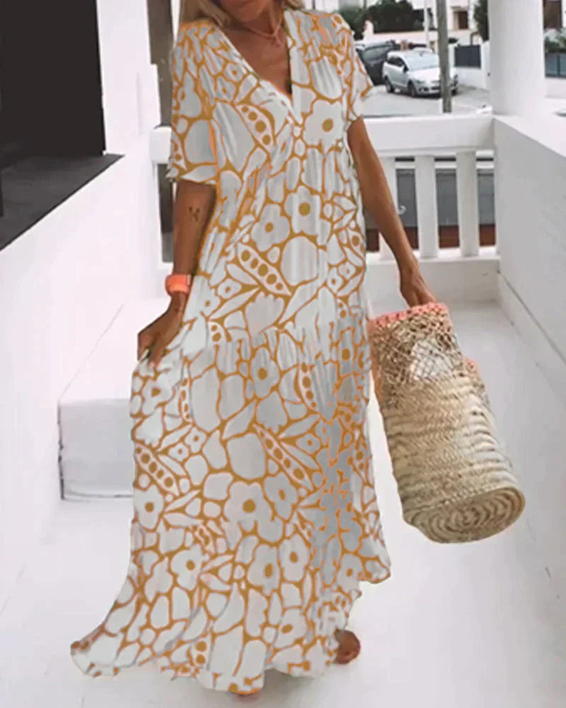 VESTIDO FLUIDO CON ESTAMPADO Y ESCOTE EN V