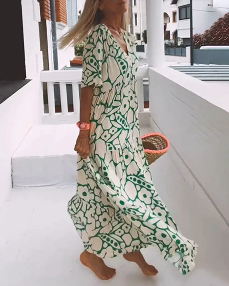 VESTIDO FLUIDO CON ESTAMPADO Y ESCOTE EN V