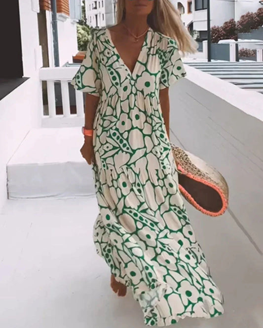 VESTIDO FLUIDO CON ESTAMPADO Y ESCOTE EN V