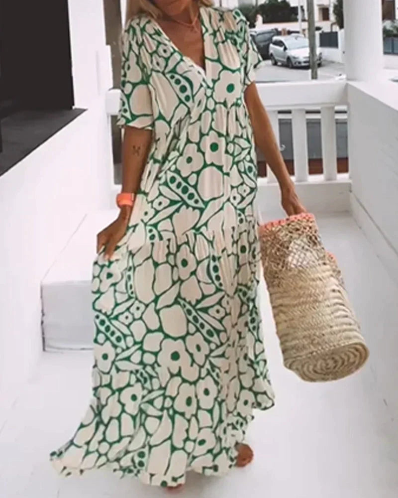VESTIDO FLUIDO CON ESTAMPADO Y ESCOTE EN V