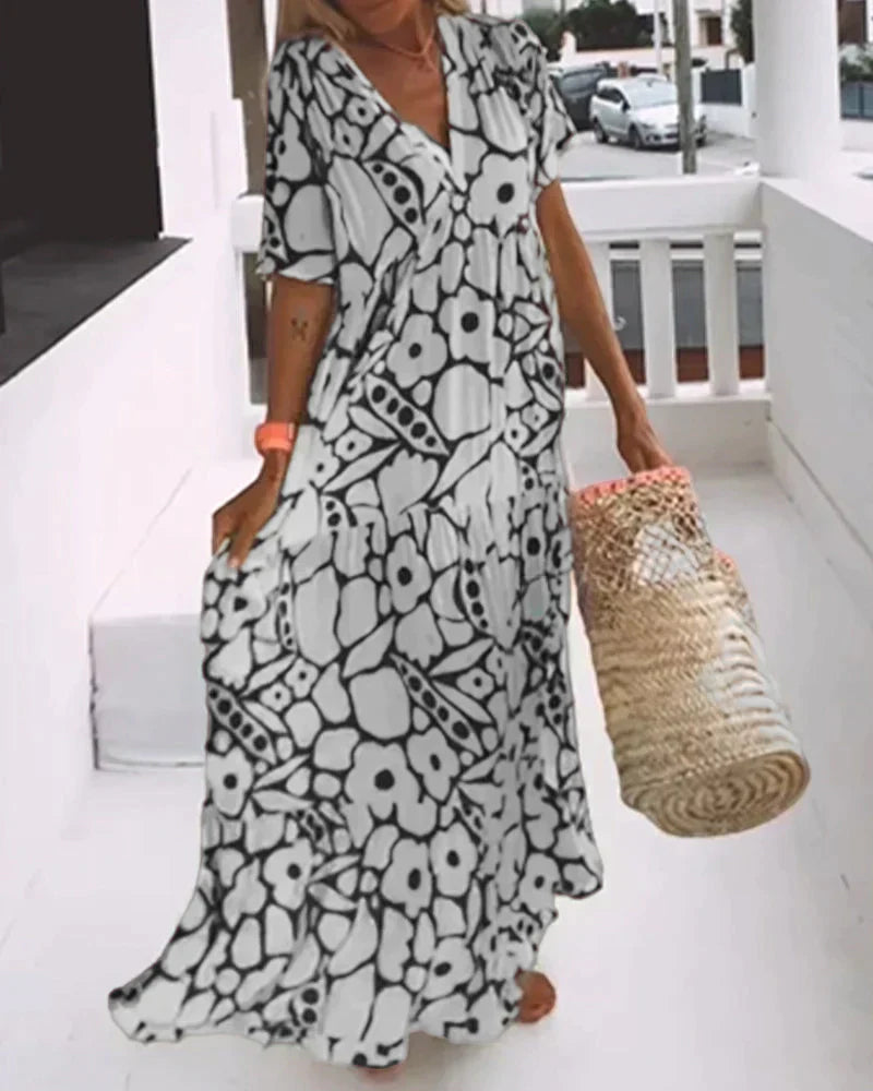 VESTIDO FLUIDO CON ESTAMPADO Y ESCOTE EN V